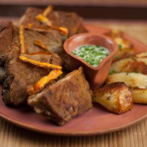 Coaste de porc cu cartofi la cuptor